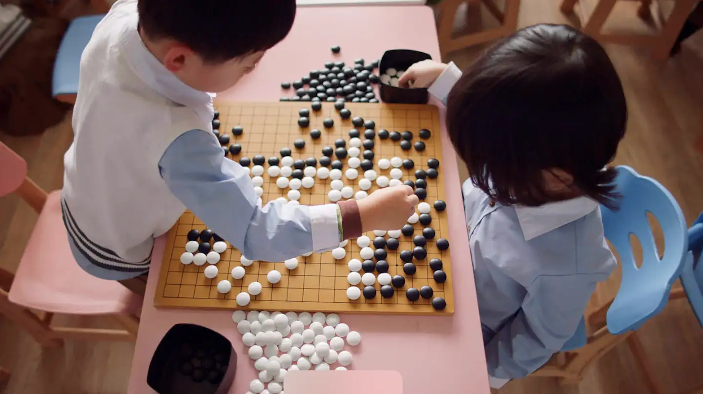 two children playing go